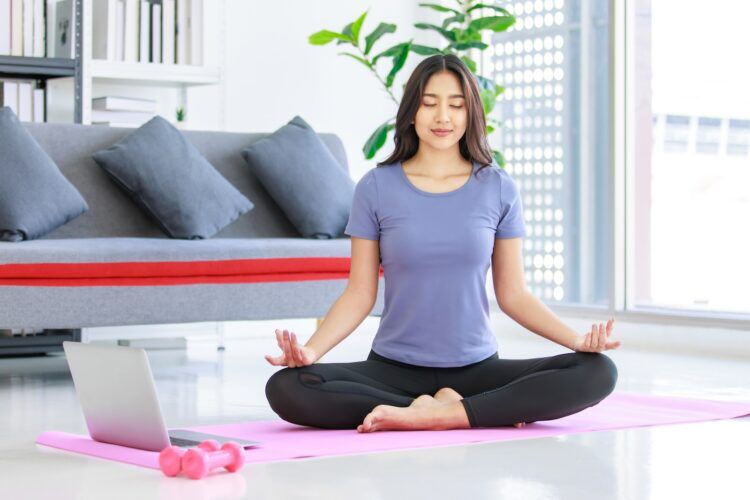 Woman in lotus position doing yoga