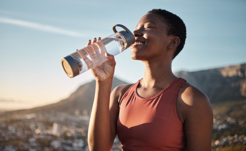 Black woman drinking water
