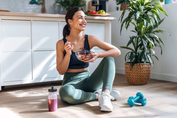 Athletic woman eating