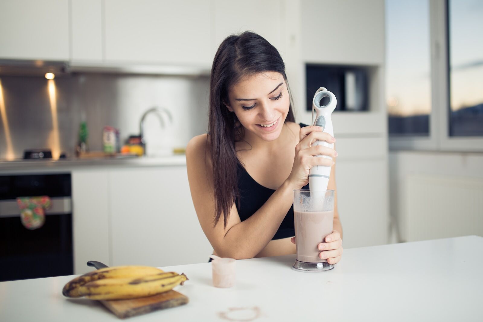 Woman,With,Hand,Blender,Making,Sweet,Banana,Chocolate,Protein,Powder