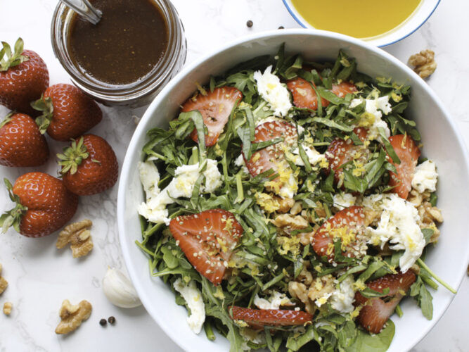 strawberry salad with dressing in a bowl
