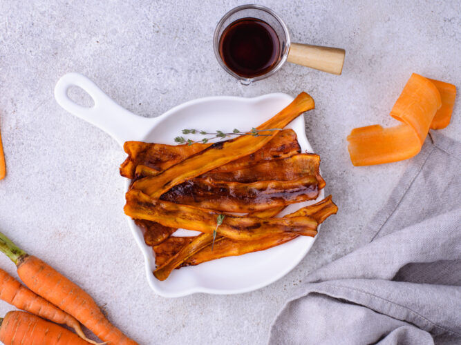 finished carrot bacon on a skillet